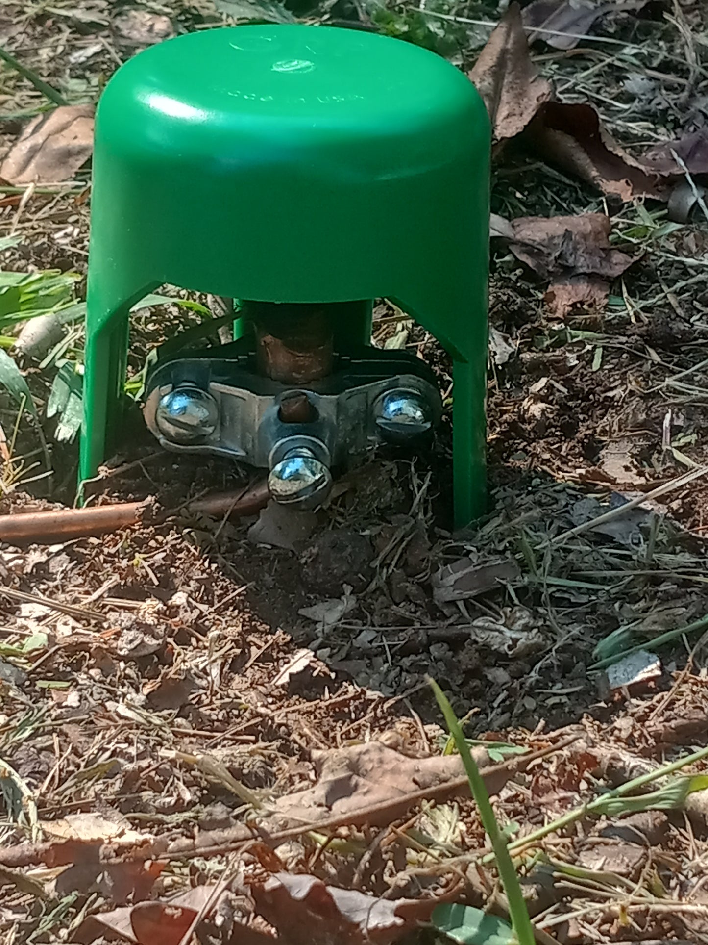 Protection of exposed ground rod.